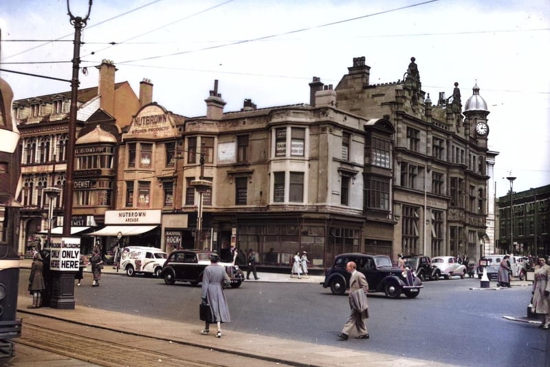 This colourised picture of the Promenade and Talbot Square from the mid 1950s has added a splash of colour to clothing. Across the Square there is a gimpse of Yates's Wine Lodge
