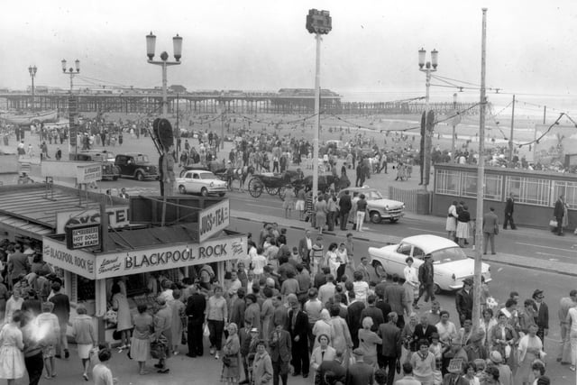 Back in 2014, an incredible archive of photos taken in Blackpool showed how we have always loved to be beside the seaside.
And this is one of them as holidaymakers queue for Blackpool Rock