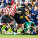 Lavery was wrestled to the ground by Blades goalkeeper Wes Foderingham
