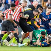 Lavery was wrestled to the ground by Blades goalkeeper Wes Foderingham