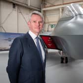 Charles Woodburn, Chief Executive Officer of BAE Systems, pictured with the full-sized mock-ip of the 6th Generation combat aircraft, the Tempest at Warton.