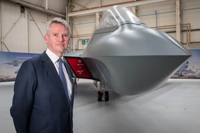 Charles Woodburn, Chief Executive Officer of BAE Systems, pictured with the full-sized mock-ip of the 6th Generation combat aircraft, the Tempest at Warton.