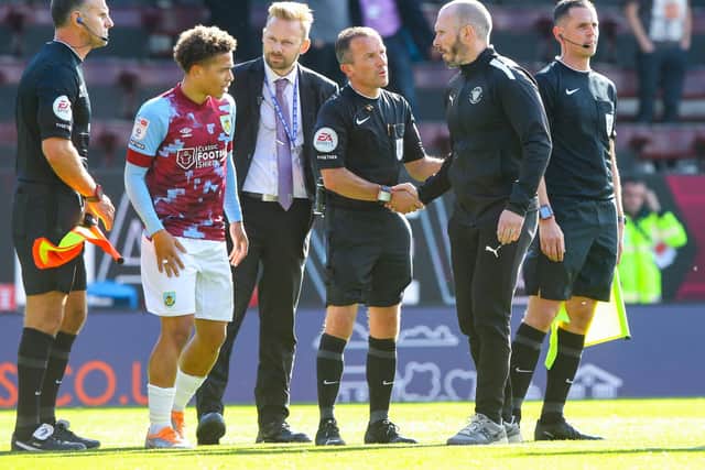 Michael Appleton shakes hands with referee Keith Stroud after Saturday's thrilling draw against Burnley