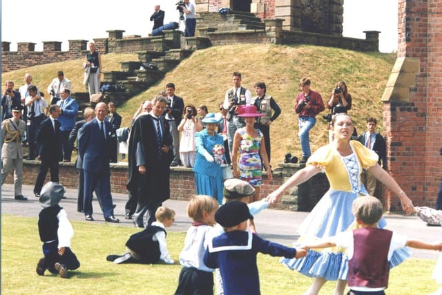 'It's over here' says the Queen, referring to a wayward marble at Rossall School in Jully 1994.  She was accompanied by  teacher Vivien Ivell and headmaster Richard Rhodes