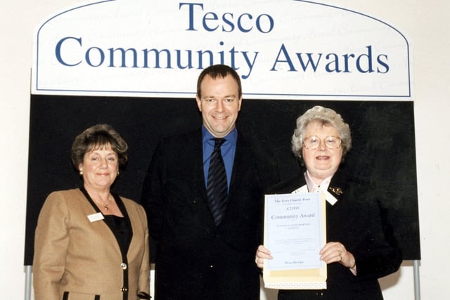 Chairman of the Blackpool, Wyre and Fylde Group of the National Osteoporosis Society, Jean Marsh, with Committee Member, Pat Newman, pictured receiving their certificate confirming the £2000 award made to them from the Tesco Community Fund. Tim Mason, Chairman of the Fund presenting the award