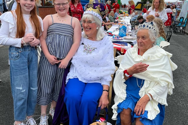 Christine Riley (centre) is Queen for the day as the residents of Galloway Road, Fleetwood, celebrate the Platinum Jubilee of HRH Queen Elizabeth II