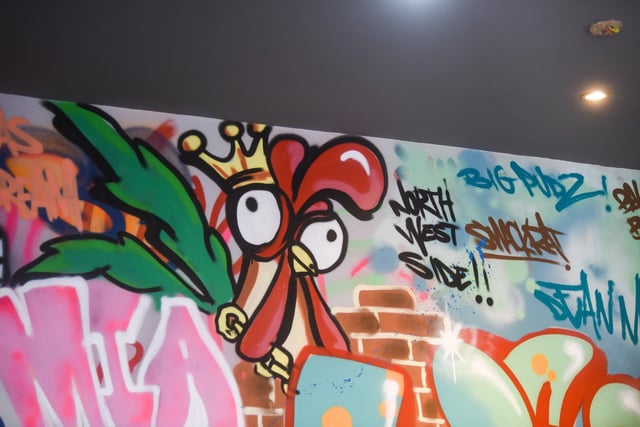 There is plenty of eye-catching wall art to be seen at Hip Hop Chicken in Cedar Square