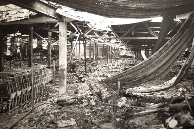 The gutted interior of the store - shopping trolleys still lined up