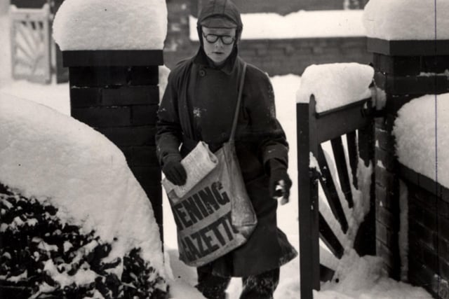 Who is the newspaper boy braving the snow?