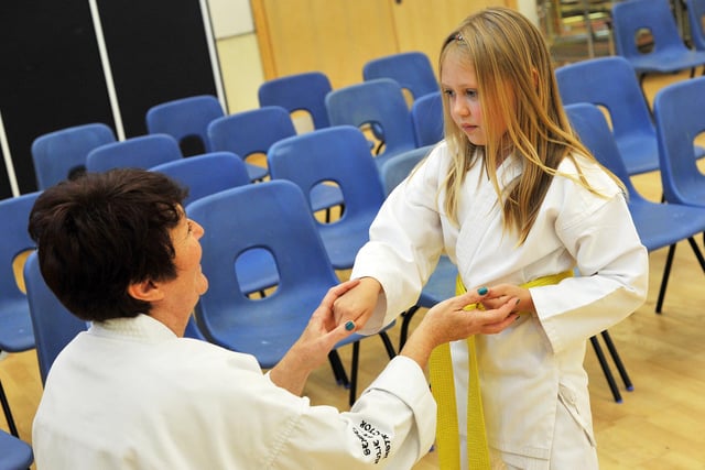 Karate instructors Sensei Julie and Sensei Tony Baker with class at Norbridge Academy.