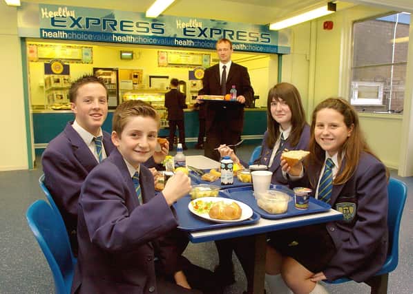 Hodgson High School's Express cafe. Business Manager Martin Pickles with, from left, Scott Murphy (12), Shane Faulkner (15), Kerry McNulty (15) and Karen McCan (11) in 2004