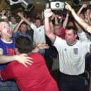 Fans celebrate at Brannigans on Market Street, Blackpool,  when the full time whistle goes. This was England v Argentina in 2002