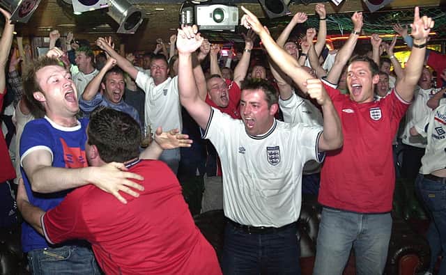 Fans celebrate at Brannigans on Market Street, Blackpool,  when the full time whistle goes. This was England v Argentina in 2002