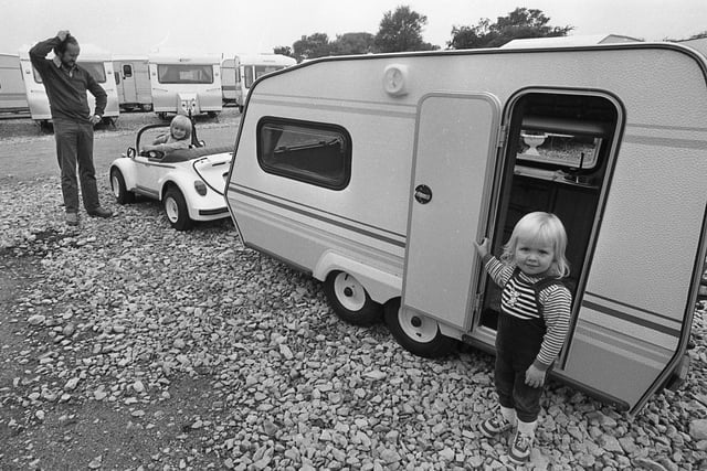 Caravan puzzler... Three-year-old Marc and two-year-old Jane Wheeler thought they had found just the thing for the family holiday when they went along with dad Trevor to Hartleys Caravans Show at Kirkham, but dad decided it was probably too small and bought a larger model instead