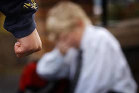 A posed image simulating a child being bullied.