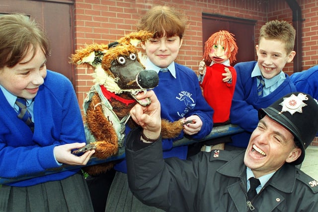 PC John Crystal finds out how sharp the teeth are, of Willy the Wicked Wolf - one of the puppets in the "Its my life" drugs awareness puppet show, performed at Layton Primary School. Watching are Kirsty McKell, Kirsty Darroch, Lee Hindle and Helena Lockwood