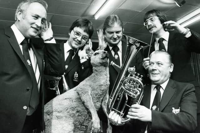 Members of Grimethorpe Colliery Band rehearsing with Joey the kangaroo in preparation for their 1982 tour of Australia. From left, Fred Partlett, Tom Paulin, Hugh Uariate, Ray Farr, and conductor Jeff Hirst with the tenor horn