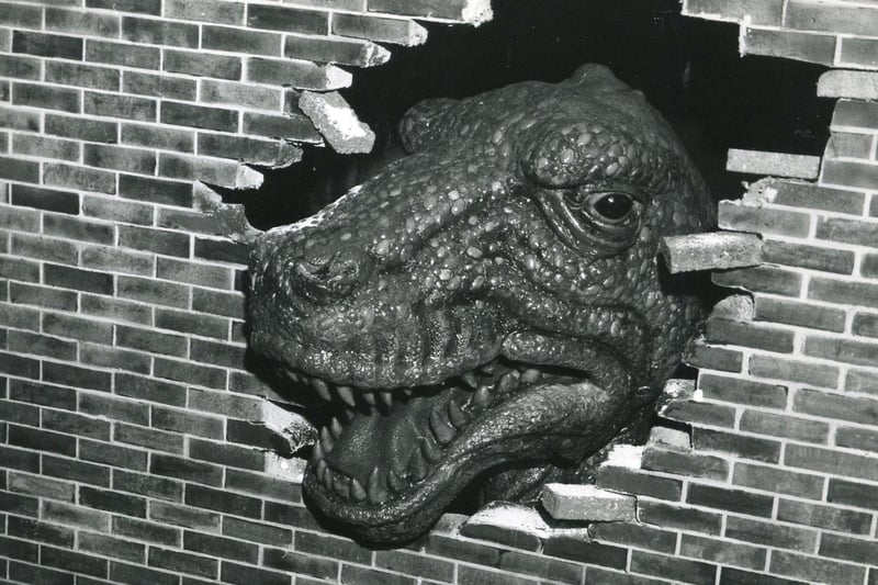 Is that a dinosaur breaking through a wall? 1970s...