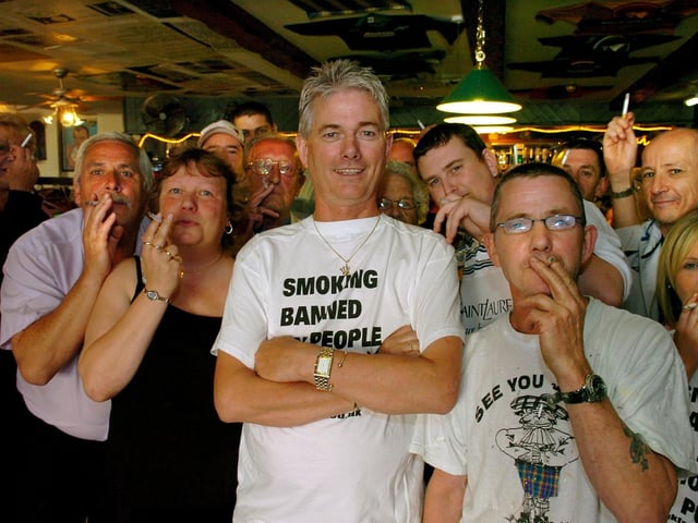 Landlord Hamish Howitt (centre) and happy smokers at the Happy Scots Bar, Rigby Road, Blackpool. They were planning to flout the smoking ban