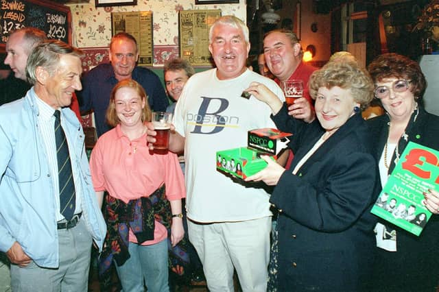 Wheatsheaf party night, 1999. Ian Thompson (centre) gets a badge from NSPCC local branch chairman June Duerden