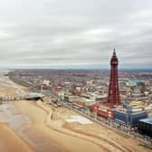 An aerial photo shows the North Pier, Blackpool Tower and the beachfront, in Blackpool, north west England on March 9, 2021. (Photo by Paul ELLIS / AFP) (Photo by PAUL ELLIS/AFP via Getty Images)