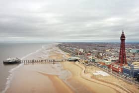 An aerial photo shows the North Pier, Blackpool Tower and the beachfront, in Blackpool, north west England on March 9, 2021. (Photo by Paul ELLIS / AFP) (Photo by PAUL ELLIS/AFP via Getty Images)