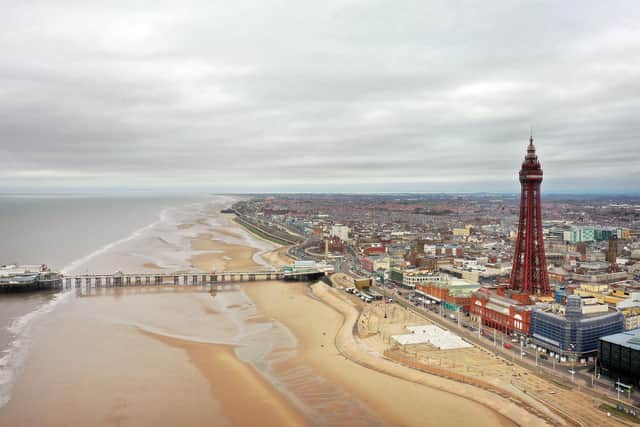 An aerial photo shows the North Pier, Blackpool Tower and the beachfront, in Blackpool, north west England on March 9, 2021. (Photo by Paul ELLIS / AFP) (Photo by PAUL ELLIS/AFP via Getty Images)