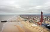 An aerial photo shows the North Pier, Blackpool Tower and the beachfront, in Blackpool, north west England on March 9, 2021. (Photo by Paul ELLIS / AFP) (Photo by PAUL ELLIS/AFP via Getty Images)