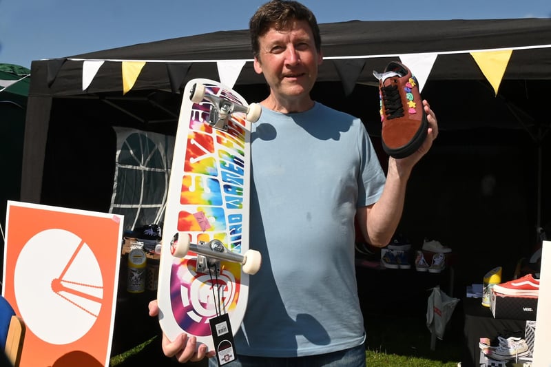 Stuart Roberts with some of the items in the silent auction held at the Ralph Fest event.