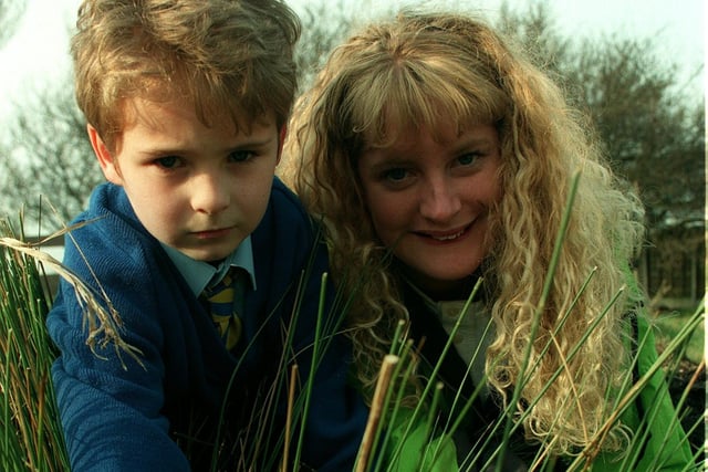 It's a jungle out there! 8 year old Sam Parkinson with Princes' Trust volunteer Helen Roylance clearing the overgrown and neglected gardens at St. Nicholas Primary School, 1997