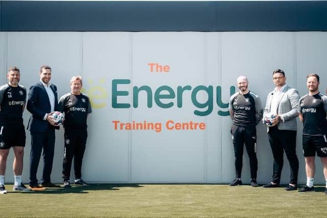 Michael Appleton and his coaching staff pictured with representatives from eEnergy