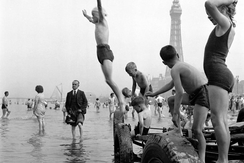 These children are having the time of their lives playing in the sea. Photo: John Gay/Historic England/Mary Evans