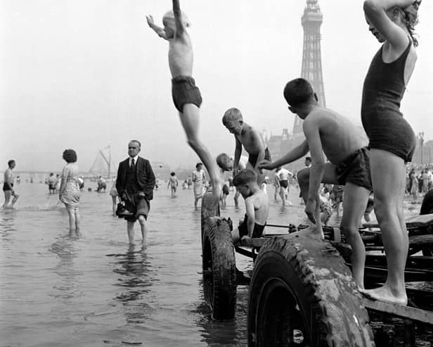 These children are having the time of their lives playing in the sea. Photo: John Gay/Historic England/Mary Evans