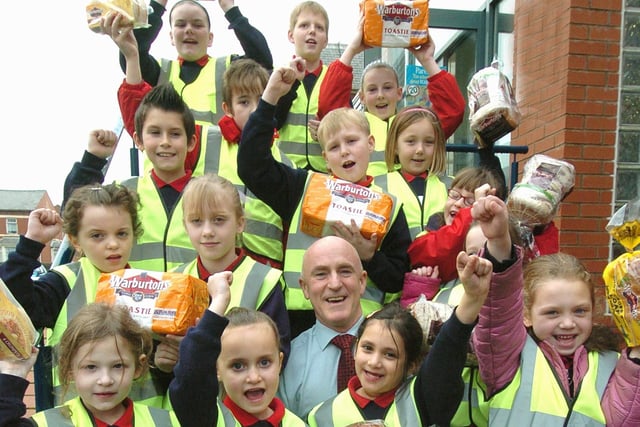 Warburtons Business Development Manager Mike Mason with Revoe Primary School (Blackpool) pupils and their new Hi-Viz jackets, 2009