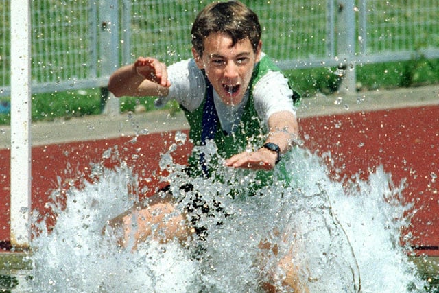 Lee Halshaw on his way to winning the U16 Boys 1500m Steeplechase at a competition held at Stanley Park in 1997