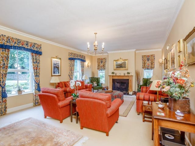 Formal drawing room with feature open fireplace.