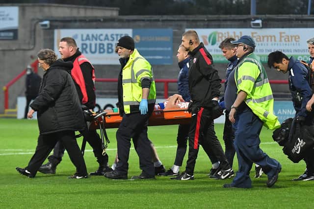 Brad Holmes was stretchered off late on Picture: Dave Howarth/CameraSport