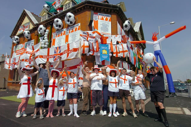 Staff and regulars at the Fleetwood Arms, Dock Street with their pub decorated for the World Cup
