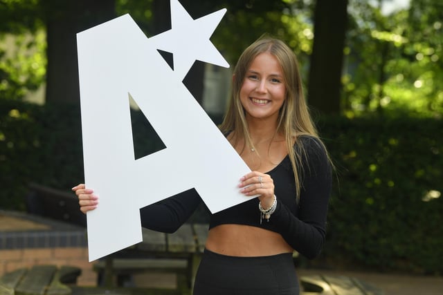 Milly Roberts celebrates her top grades