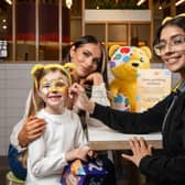 Amy Childs visits McDonald’s with her daughter Polly to have their faces painted. Photo: PA