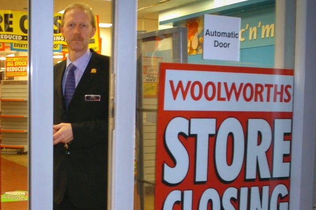 Woolworths store manager Manager Brian Heeler watches the doors close for good