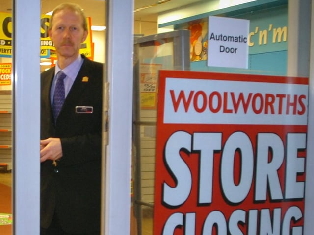 Woolworths store manager Manager Brian Heeler watches the doors close for good
