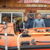 Tom Pemberton (centre) shapes up for Leg It For the Lifeboats with Lytham St Annes RNLI volunteers