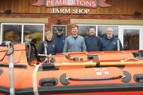 Tom Pemberton (centre) shapes up for Leg It For the Lifeboats with Lytham St Annes RNLI volunteers