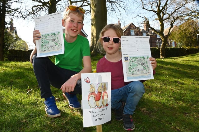 BLACKPOOL GAZETTE - LYTHAM - 08-04-23  Family fun at Lowther's Easter Surprise, with music, entertainment, fun fair and crafts over easter weekend at Lowther Gardens, Lytham. Fred Keane, nine, with sister Florence, five, have fun on the Easter egg hunt around Lowther Gardens.