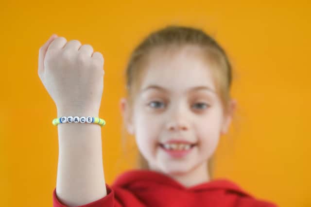 The word on her bracelet says it all - Harriet Issitt, from Our Lady of the Assumption Primary, who has been helping to raise money for Ukraine