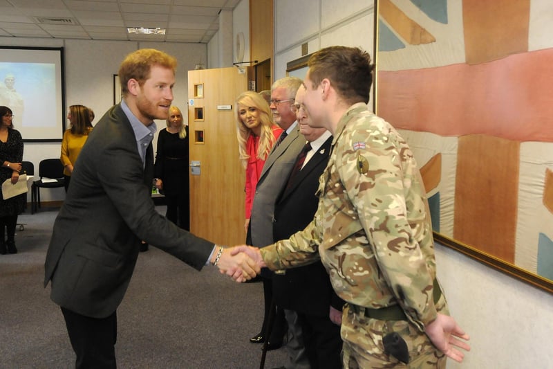 Prince Harry visits Veterans UK at Norcross.  He is pictured with Cpl Bradley Rawcliffe.