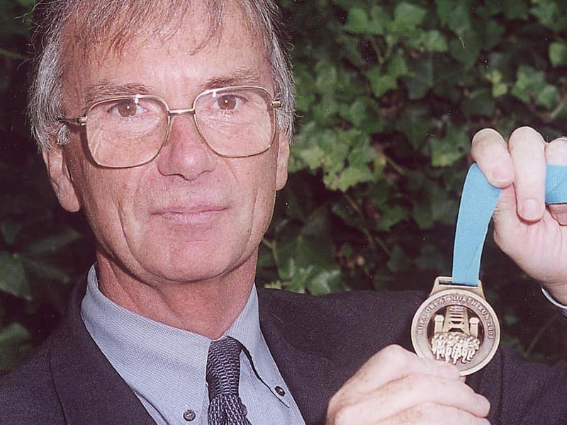 Cardinal Allen High School headteacher John O'Brien with a medal