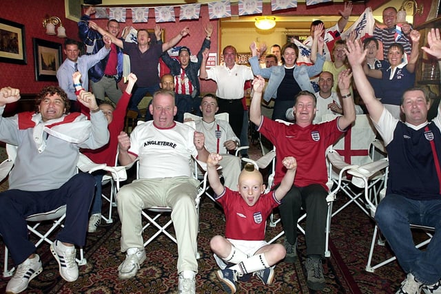 Staff and regulars at the Halfway House pub in South Shore practice their celebrations ahead of England 's crucial World Cup match against Argentina
