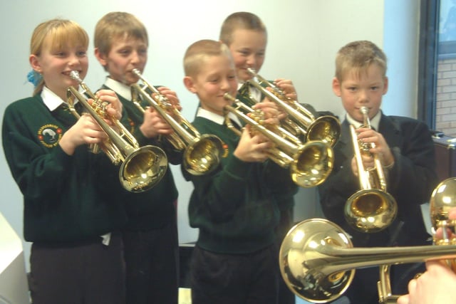 Shakespeare Primary school pupils play brass instruments at Fleetwood High School 's after school club